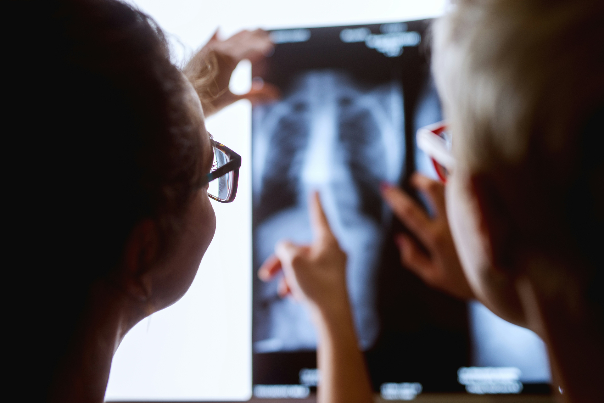 Clinicians reviewing an X-ray